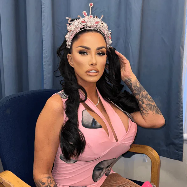 Client in pink wearing a jewelled crown, with long waves and glam makeup